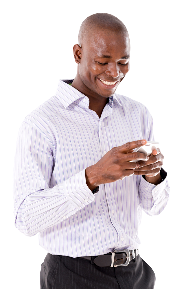 Business man texting on his mobile phone  - isolated over a white background copy